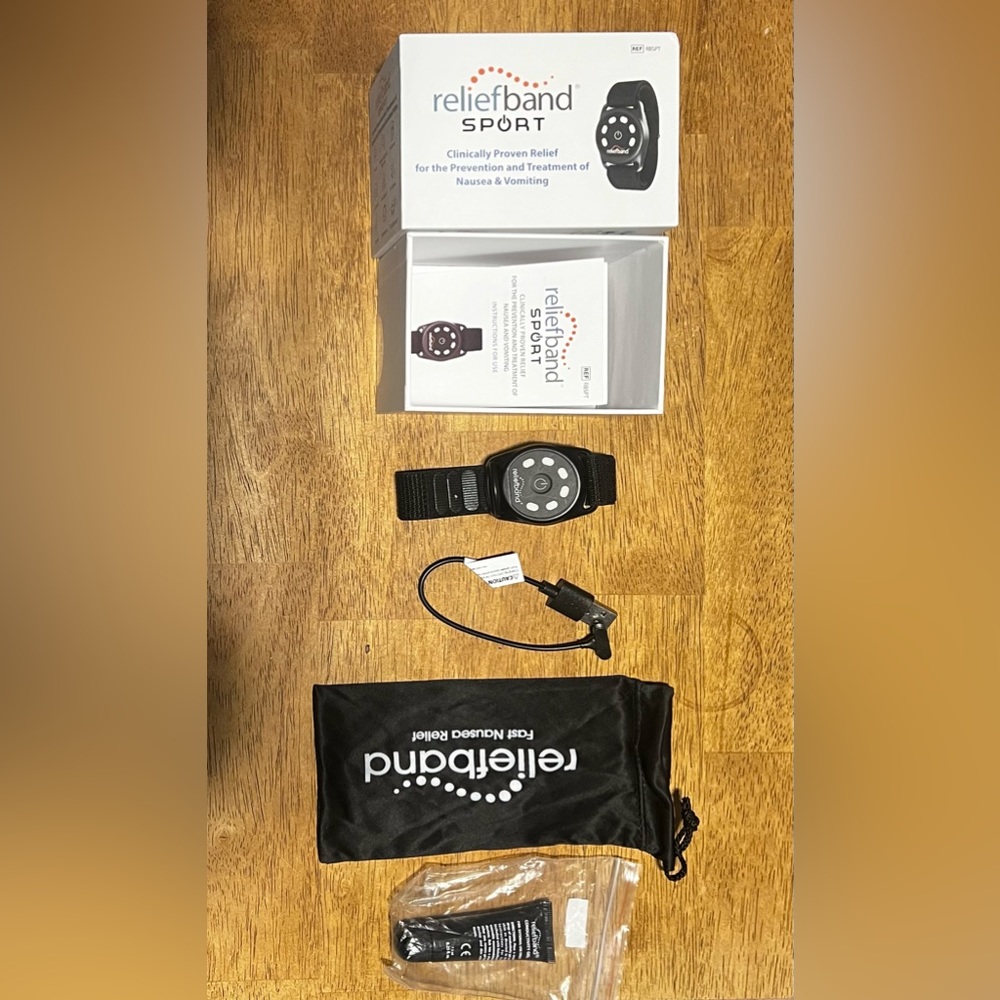 Reliefband, bag, charging cable and tube of conductivity gel. Used a few times.